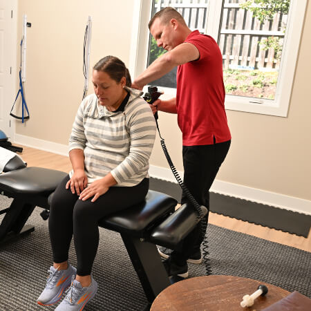 South Elgin chiropractor adjusting patient with Activator technique