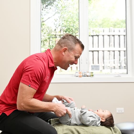 South Elgin chiropractor Dr. Buss adjusting a pediatric patient
