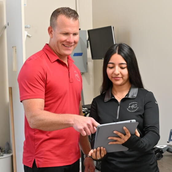 Dr. Buss in discussion with staff member