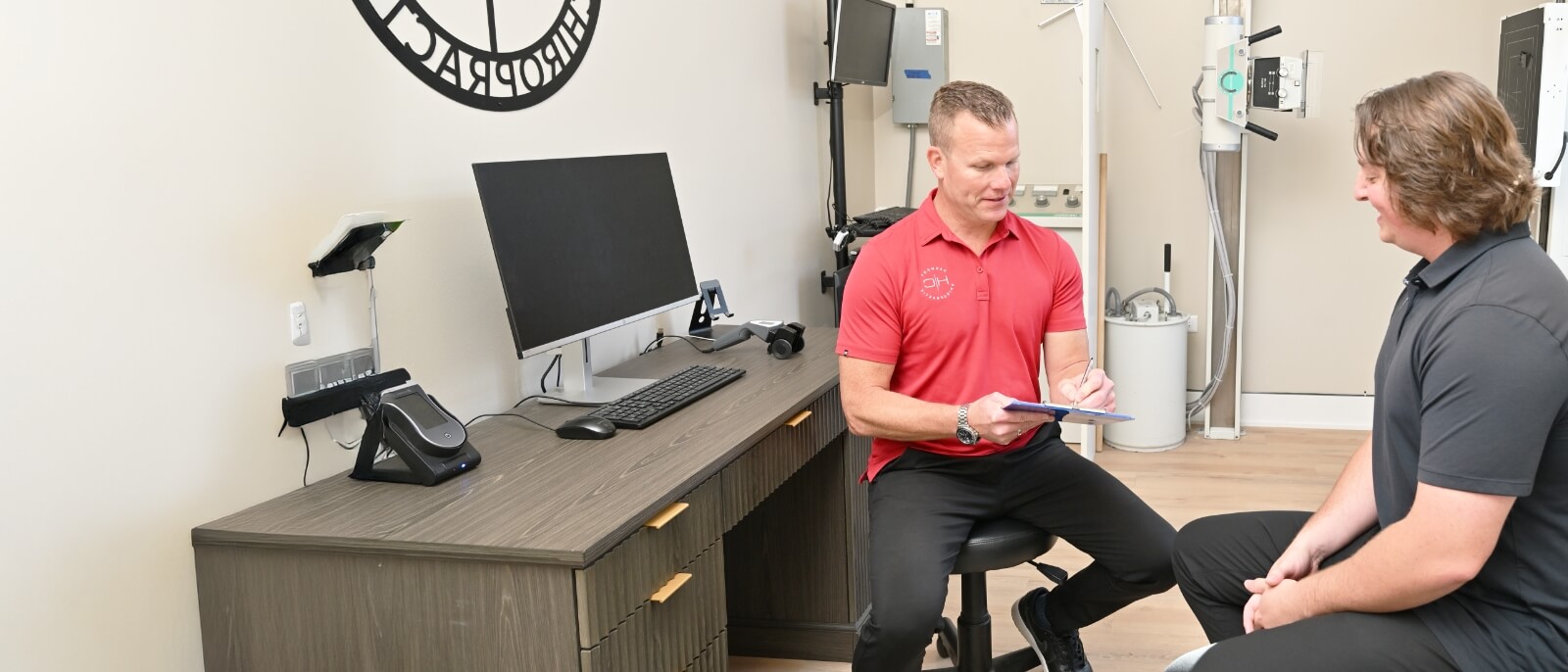 South Elgin patient in a consultation with a chiropractor