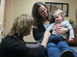 Waterford Chiropractor Jenny Geiger with a baby