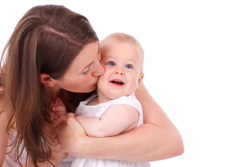 mother kissing baby