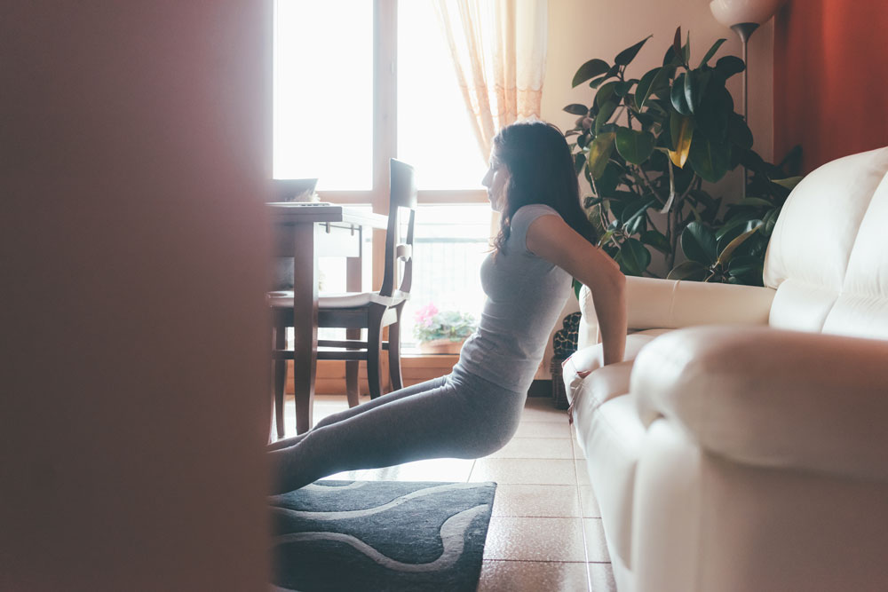 graphicstock-young-beautiful-eastern-woman-doing-yoga-on-living-room-indoor-in-apartment-relaxing-meditation-quiet-concept_Spx2Dc451b