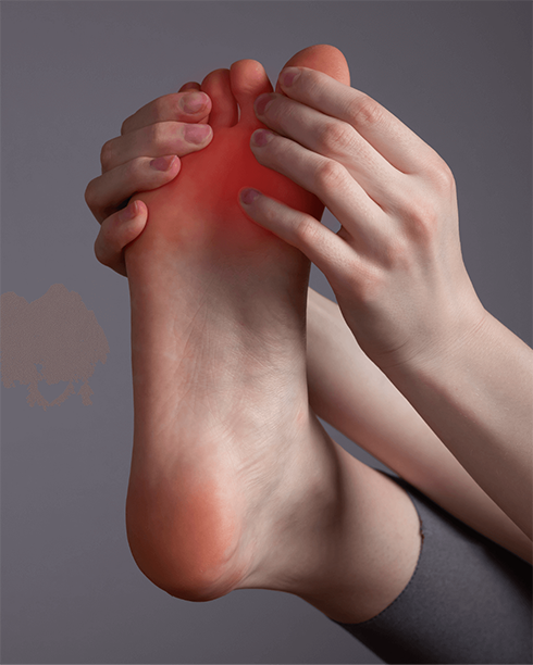 closeup of woman holding foot in pain