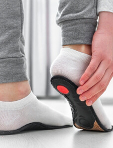 Woman fitting orthotics