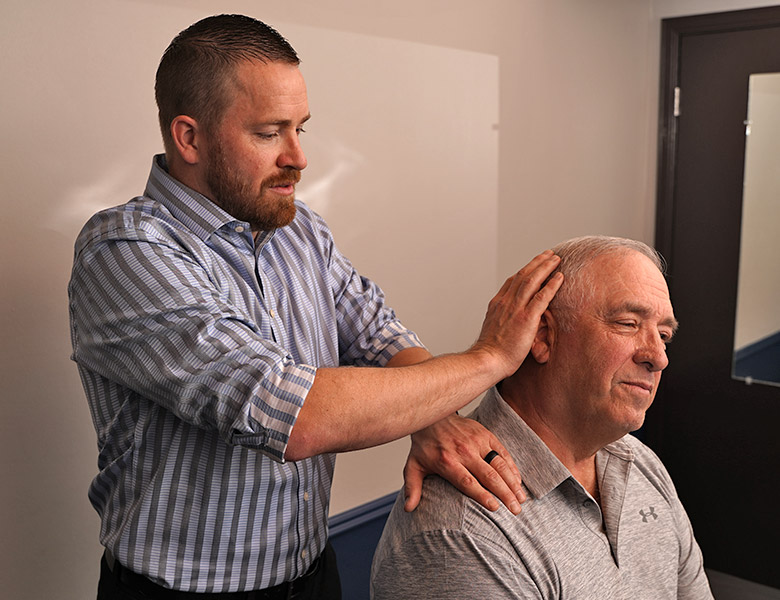 Dr Jason adjusting mans neck