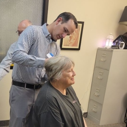 Dr Jackson adjusting womans neck