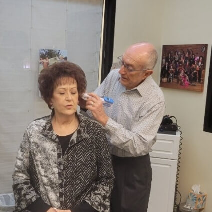 doctor checking womans ear