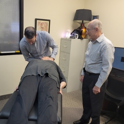 Dr Jackson adjusting patients neck