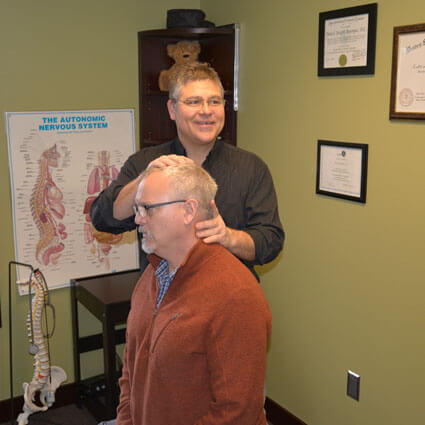 Dr. Dan adjusting mans neck