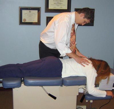 Dr. Aaron adjusting patient
