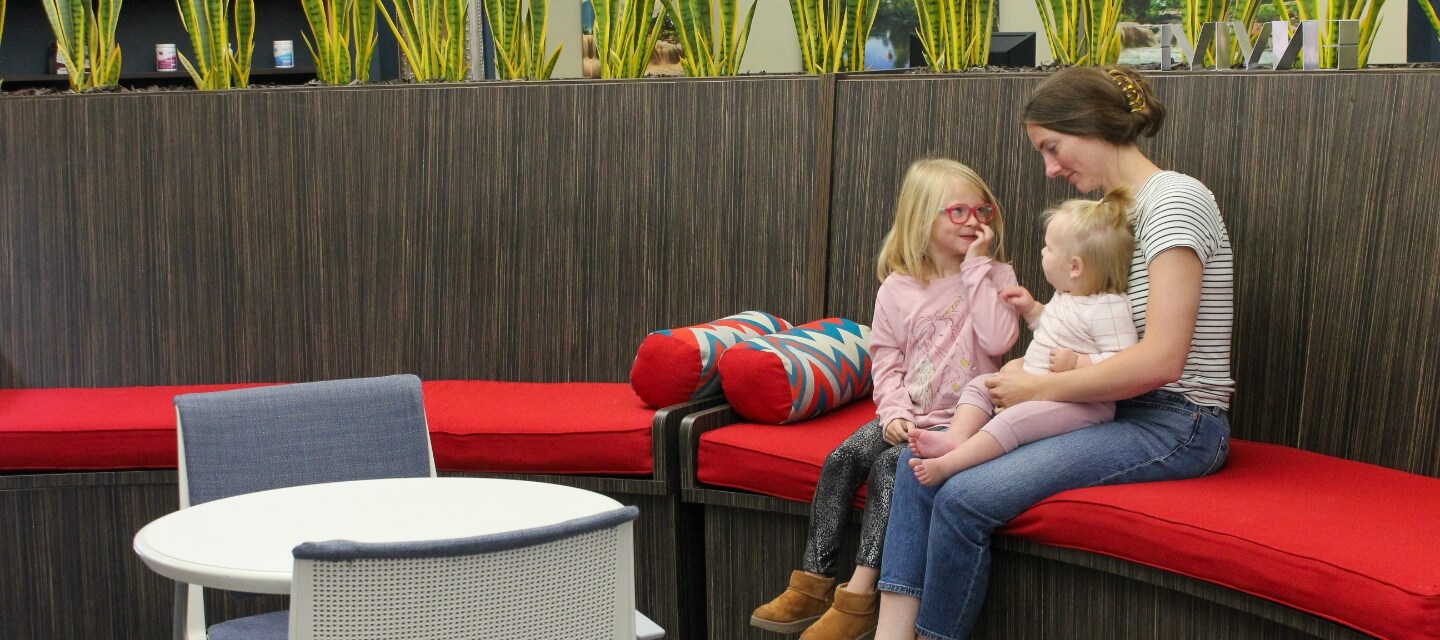 Sioux Falls patient with her children sitting in our waiting area