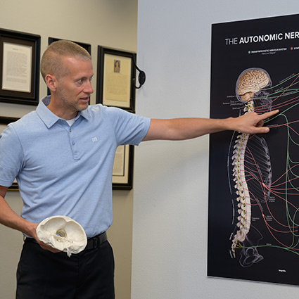 Dr Ryan explaining spine health