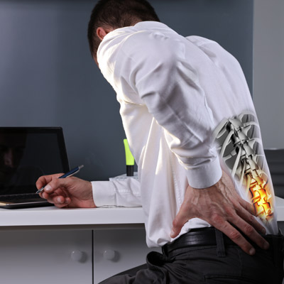 Man holding lower back in pain