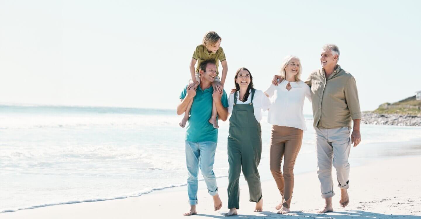 happy family walking on the beach