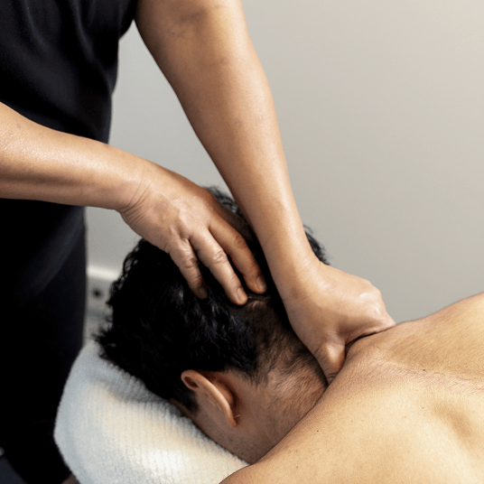 Pickford Chiropractic Clinic massage therapist working on clients back