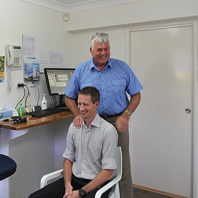 Dr Mark Pickford, Chiropractor adjusting patient