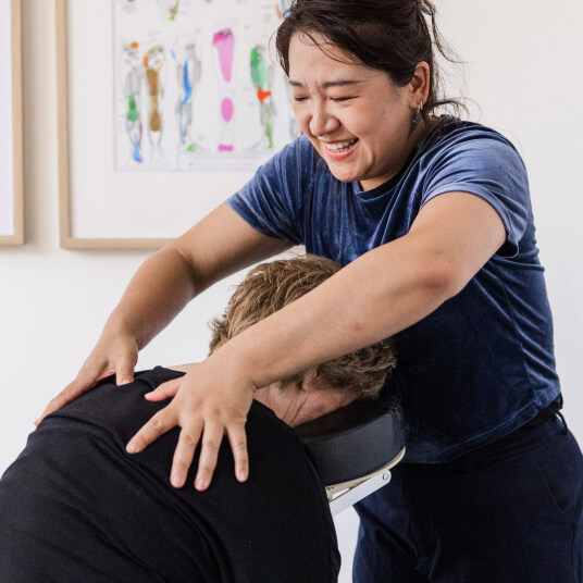 Pickford Chiropractic Clinic massage therapist working on clients back