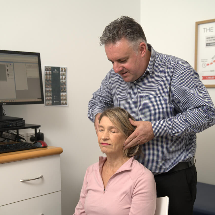 Dr Craig adjusting womans neck