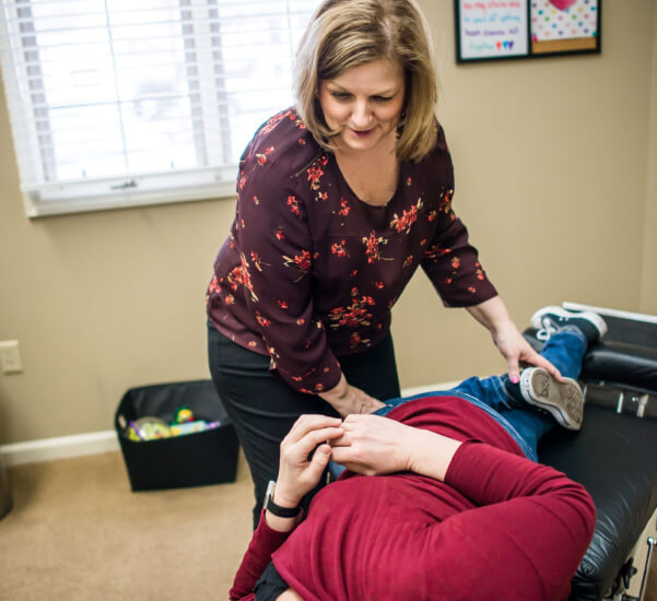Dr. Jung stretching patient leg