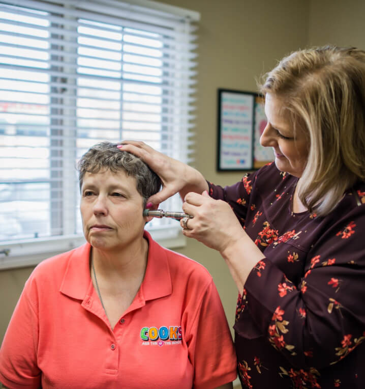 Dr. Jung using activator on patient