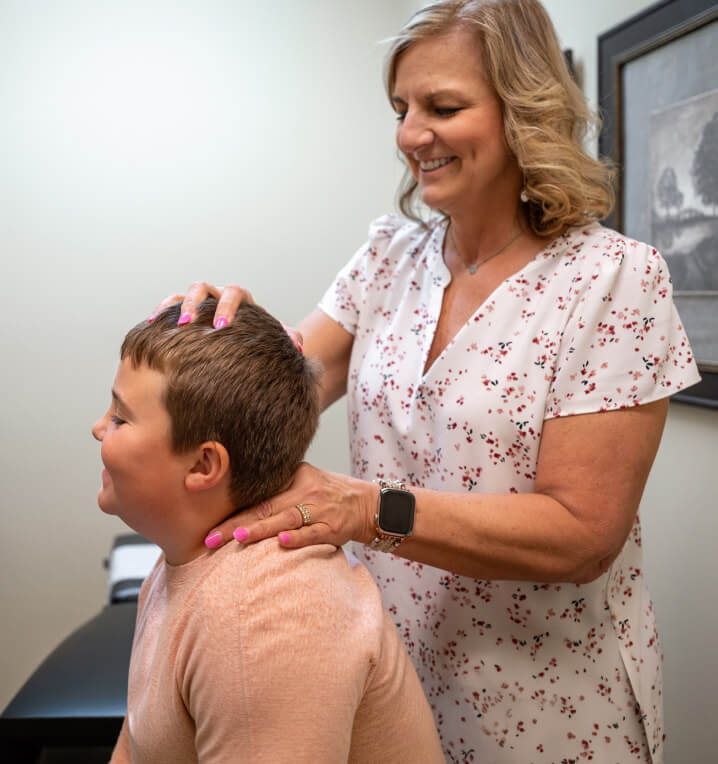 Dr. Jung using activator on patient