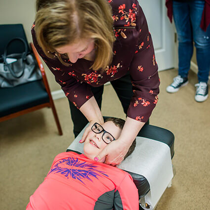 Ottawa chiropractor adjusting a pediatric patient
