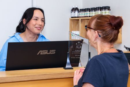 Hamilton patient checking in at Health-Performance Chiropractic