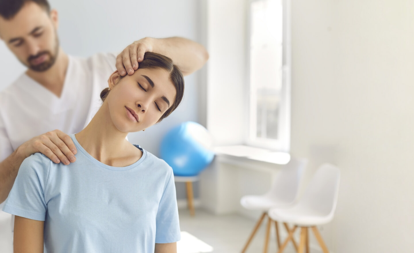 man stretching mans neck