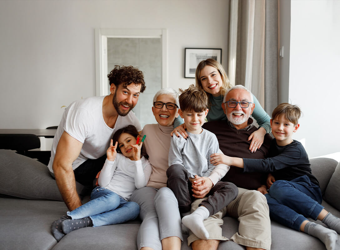 multigeneration family sitting on couch