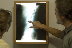 Dr. Hurd shows a patient her x-ray at Atlanta Natural Health Clinic
