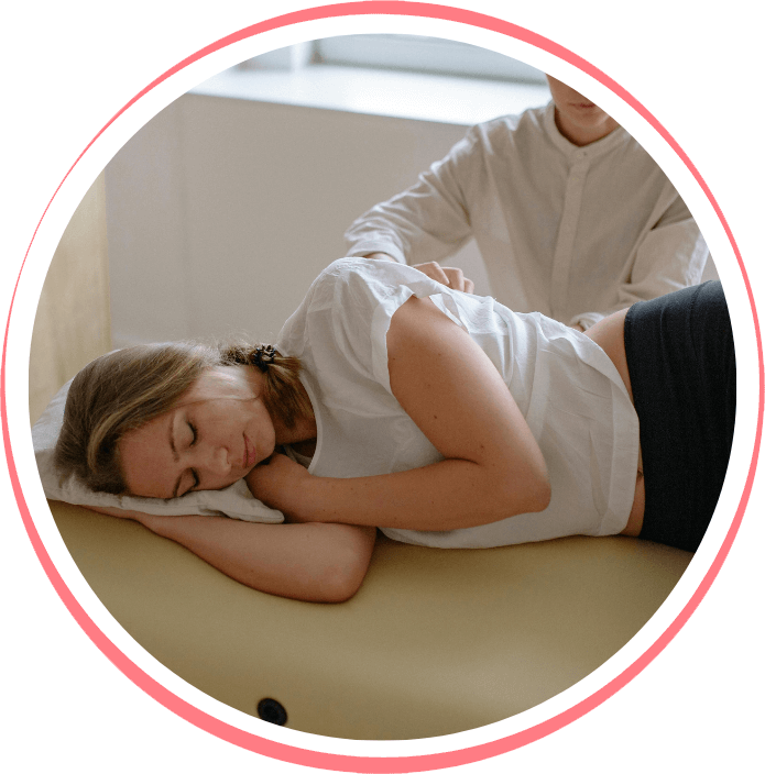 woman laying on side during chiropractic adjustment