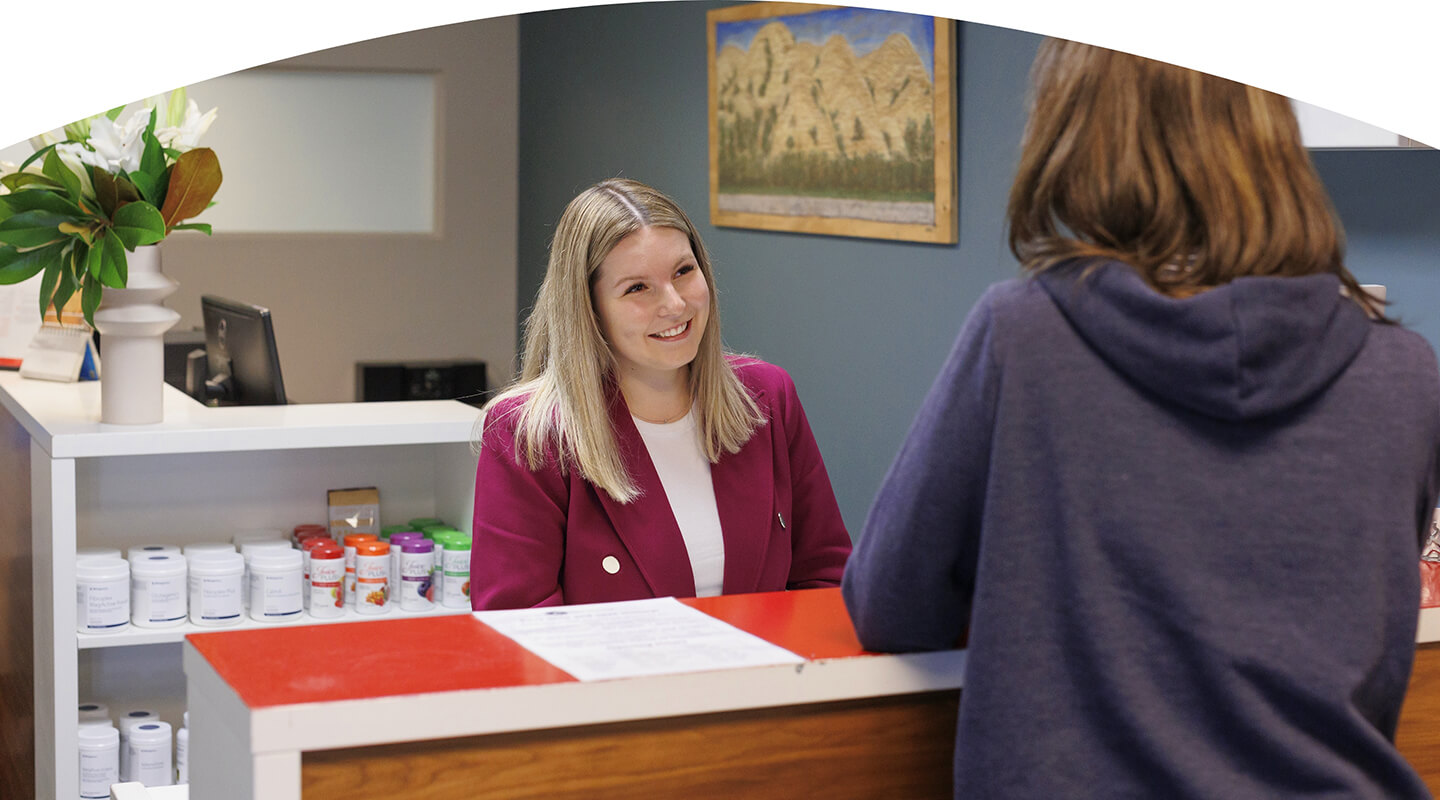 Receptionist smiling at patient
