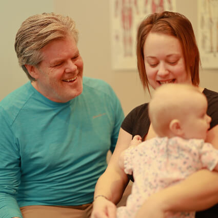 Doctor with mother and baby