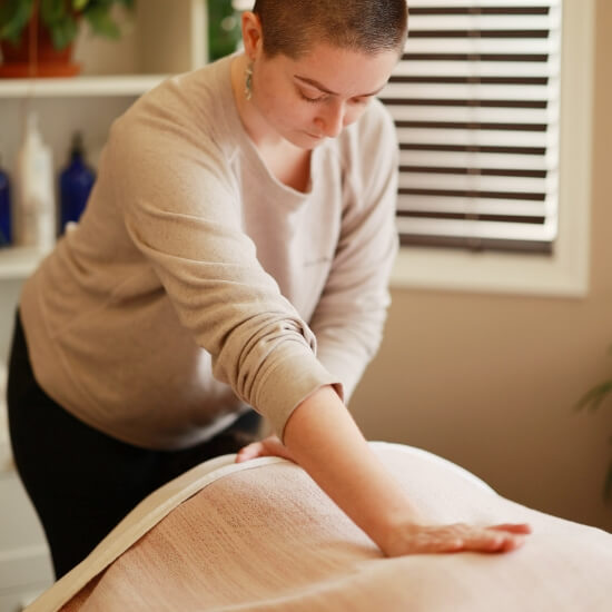 massaging patient's back