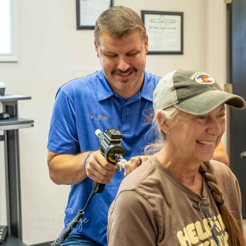 Dr. Matthew Allen adjusting a patient