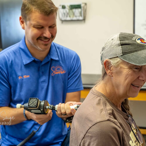 Stillwater chiopractor treating patient with Shockwave Therapy