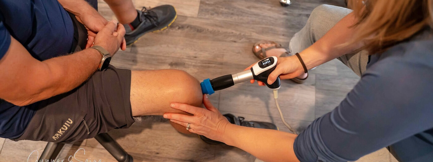 Patient receiving Shockwave Therapy treatment on knee