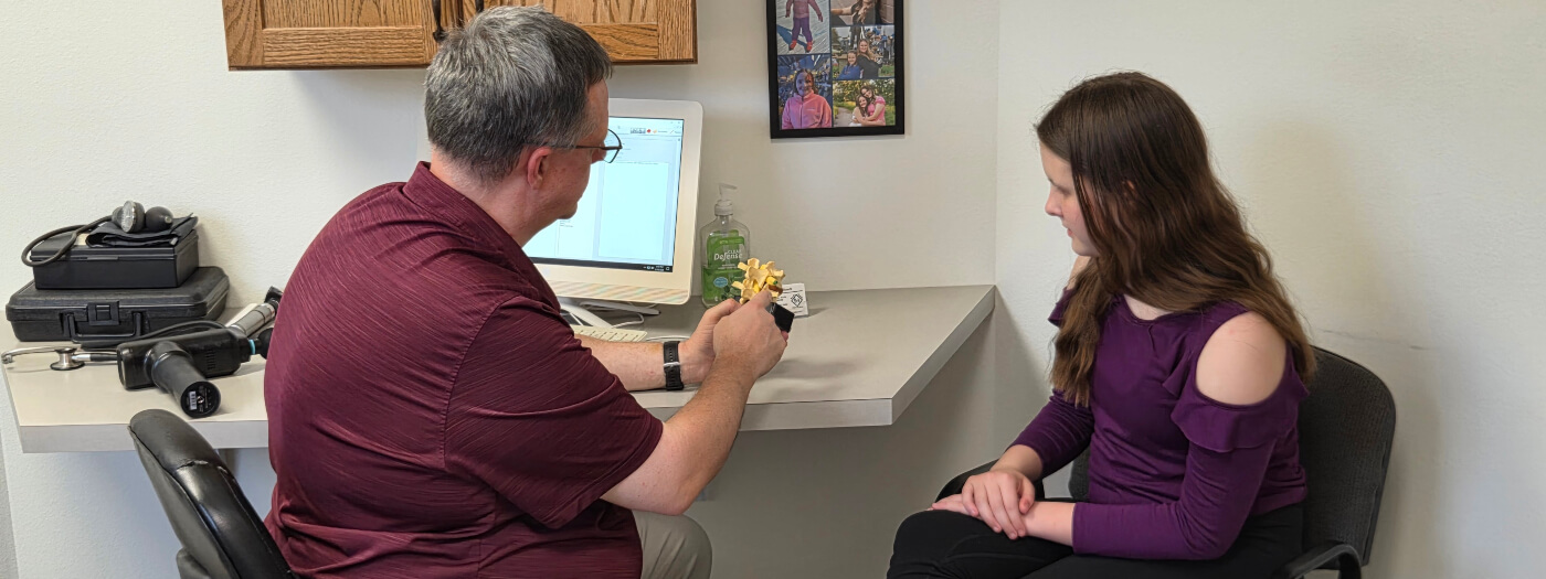 Fargo chiropractor in a consultation with a patient