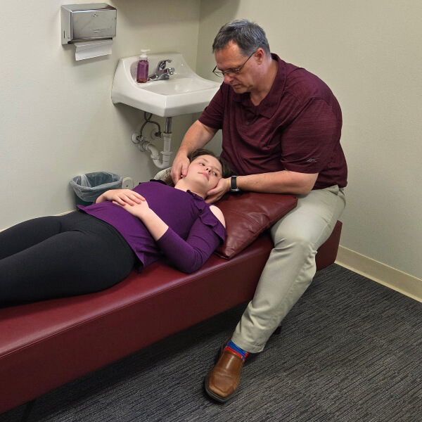 Fargo patient receiving a chiropractic neck adjustment