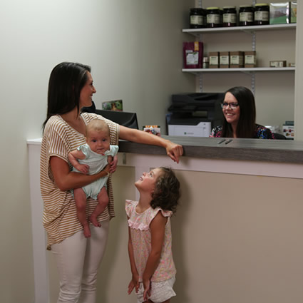 Family at reception desk