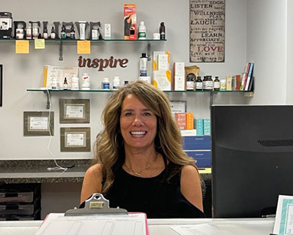 Dr. Susie behind desk