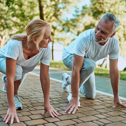 adult-couple-stretching-before-run-sq