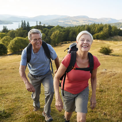mature couple backpack on mountain