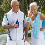 senior-couple-playing-tennis