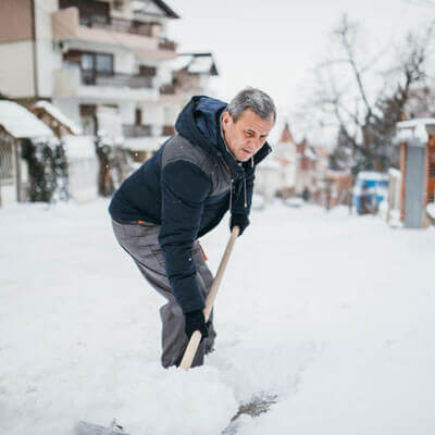 man shovelling snow