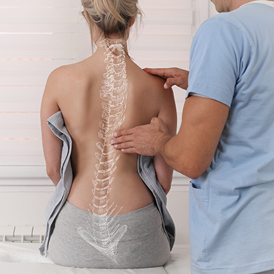 woman with an illustration of a spine overlaid on her back