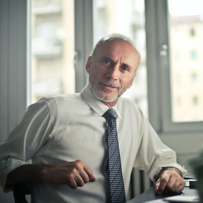 man in office with sleeves up