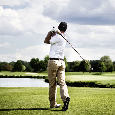 man golfing on a sunny day