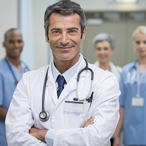 Medical doctor and staff at the background